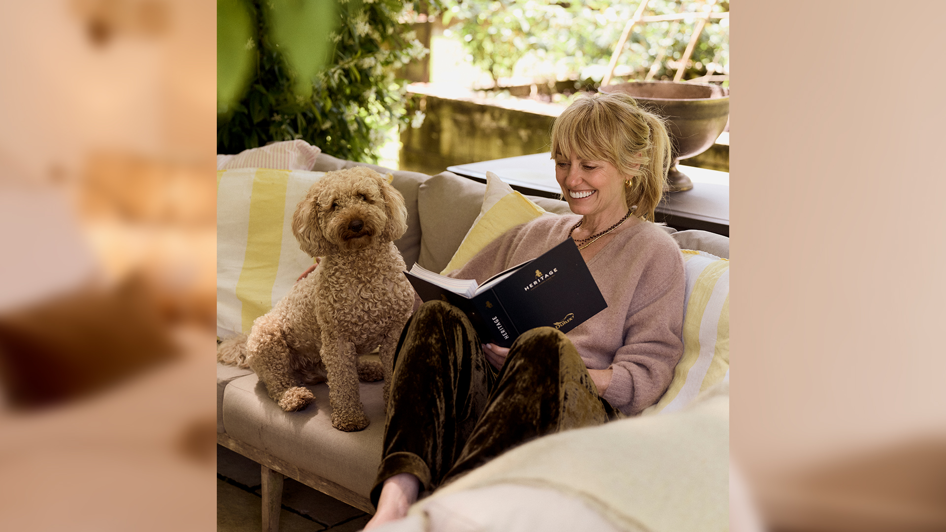 Clodagh Mckenna with her dog at her home painted in Dulux Heritage colours
